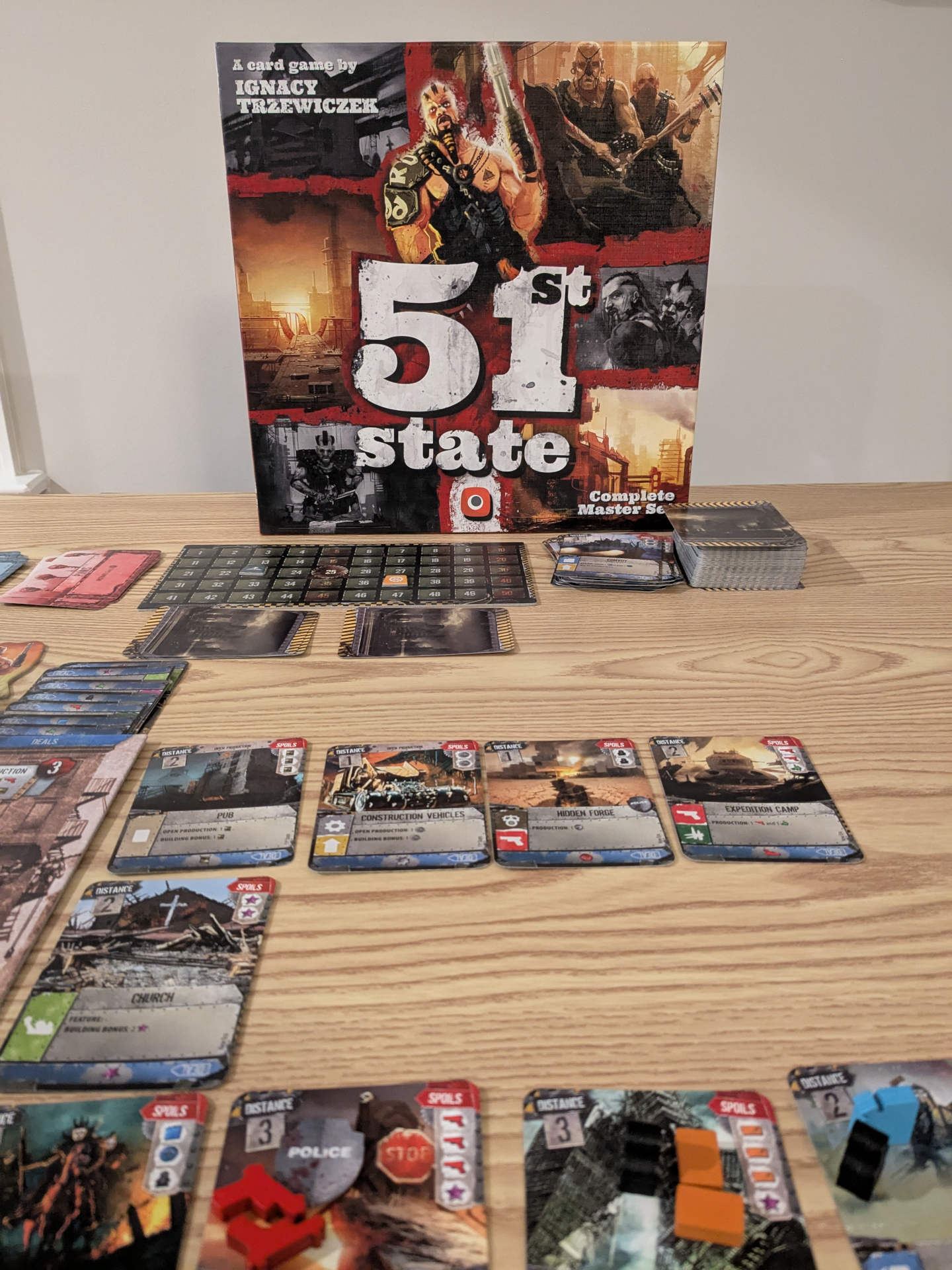 A 51st State game in-progress with the box art in the background.