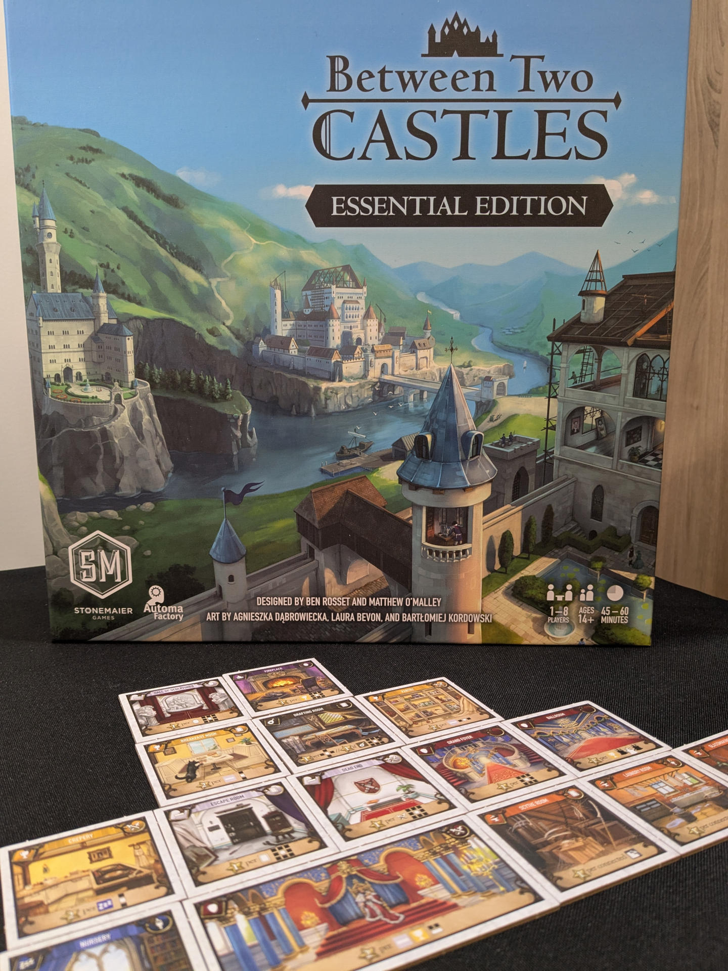 A castle and the Between Two Castles box art.